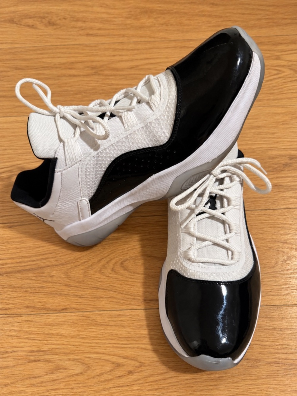 Air Jordan 11 CMFT Low White Black Patent Leather Sneakers